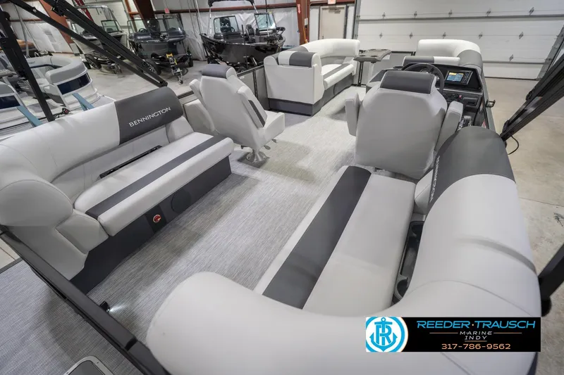 Slide: The Image of Luxurious interior of 2026 Bennington 20 SSR pontoon boat in showroom setting. - 14