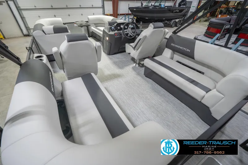 Slide: The Image of 2026 Bennington 20 SSR pontoon boat interior with plush seating and modern helm. - 15