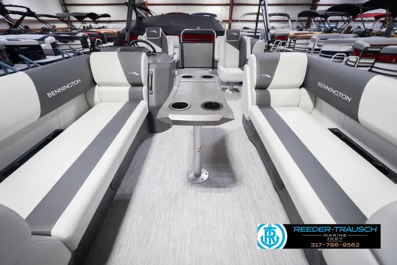 Slide: The Image of 2026 Bennington 20 SSR pontoon boat interior with gray and white seating and table. - 16