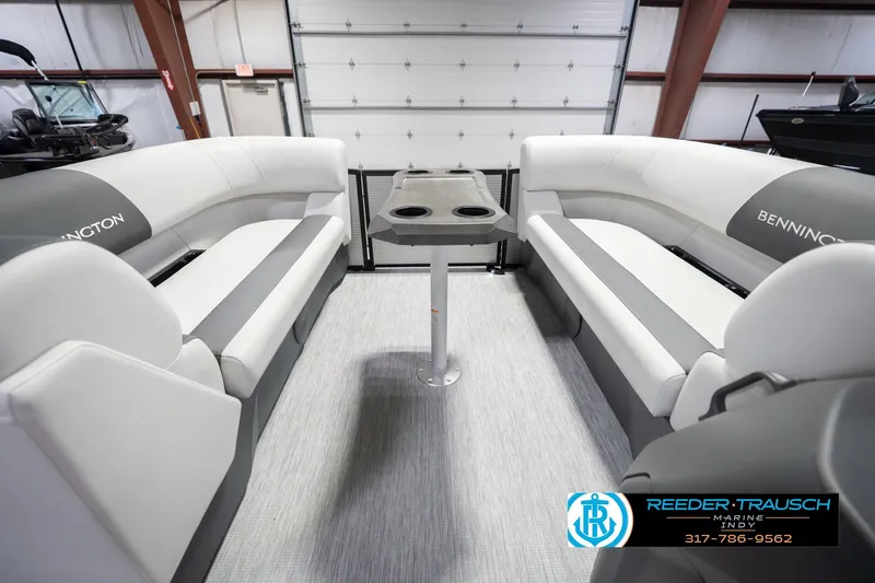 Slide: The Image of 2026 Bennington 20 SSR boat interior with gray seating and central table. - 21