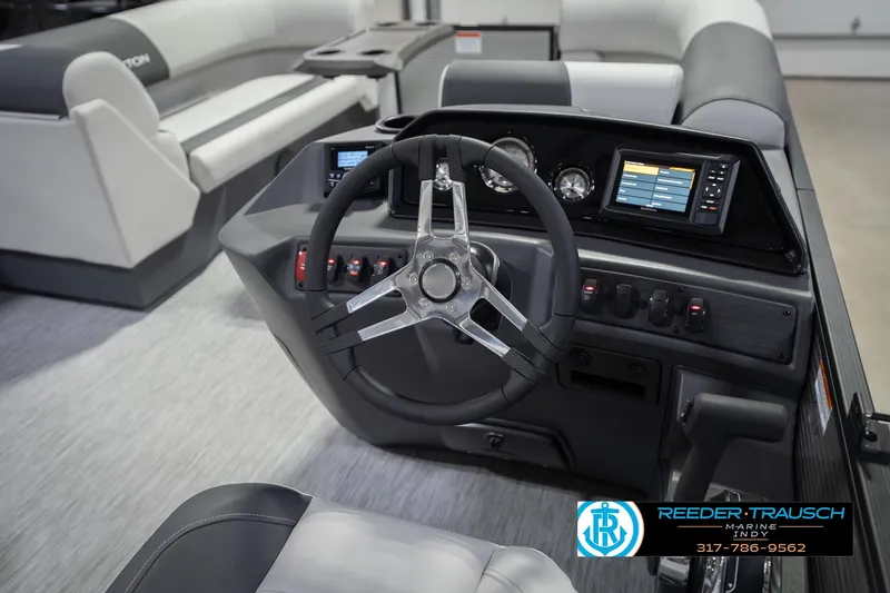 Slide: The Image of 2026 Bennington 20 SSR boat dashboard with steering wheel and digital displays. - 30