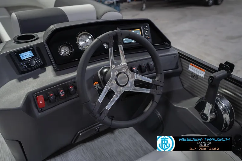 Slide: The Image of 2026 Bennington 20 SSR boat dashboard with steering wheel and control panel. - 31