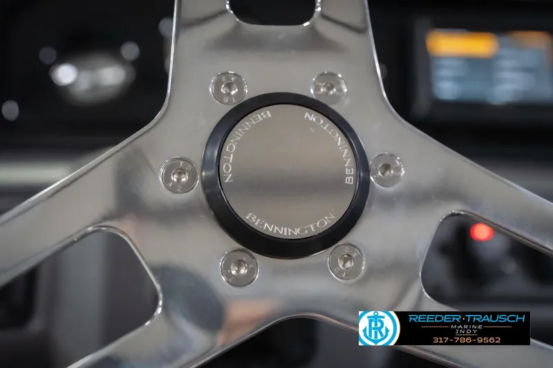 Slide: The Image of Close-up of 2026 Bennington 20 SSR steering wheel with logo. - 32