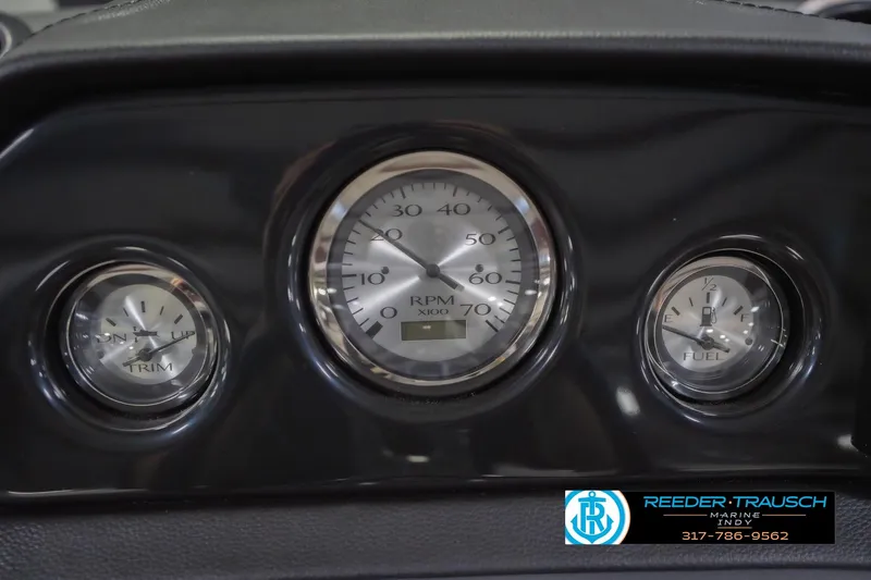 Slide: The Image of Dashboard gauges of a 2026 Bennington 20 SSR boat, showing RPM, trim, and fuel levels. - 35