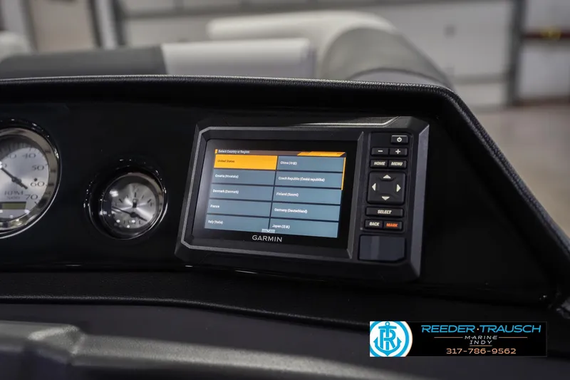 Slide: The Image of Dashboard of 2026 Bennington 20 SSR with Garmin navigation system display. - 36