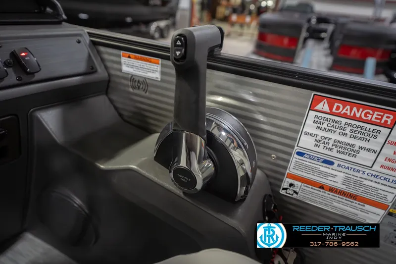 Slide: The Image of 2026 Bennington 20 SSR boat throttle control with safety warnings and dealership logo. - 38