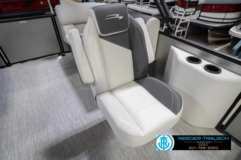 Slide: The Image of 2026 Bennington 20 SSR boat seat with gray and white upholstery, cup holders, showroom display. - 41