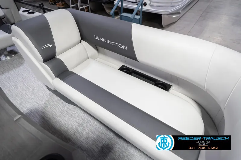 Slide: The Image of 2026 Bennington 20 SSR boat interior with gray and white seating, Reeder-Trausch Marine logo. - 43