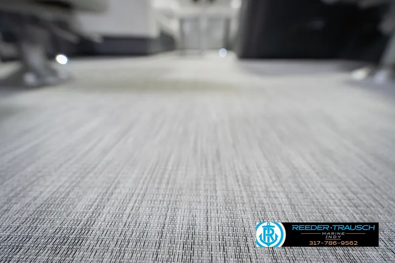 Slide: The Image of Carpeted floor of a 2026 Bennington 20 SSR boat, featuring Reeder-Trausch Marine logo. - 46