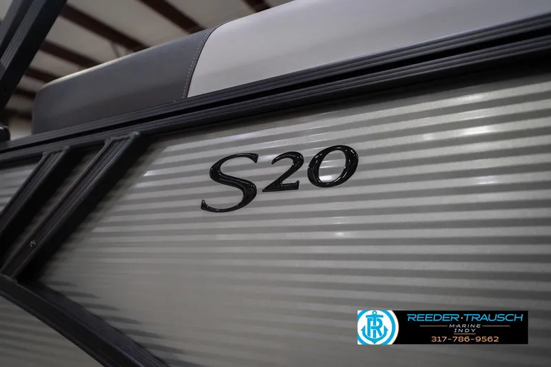 Slide: The Image of 2026 Bennington 20 SSR boat side view with "S20" emblem. - 49