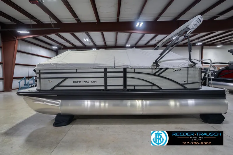 Slide: The Image of 2026 Bennington 20 SSR pontoon boat in a showroom with protective cover. - 51
