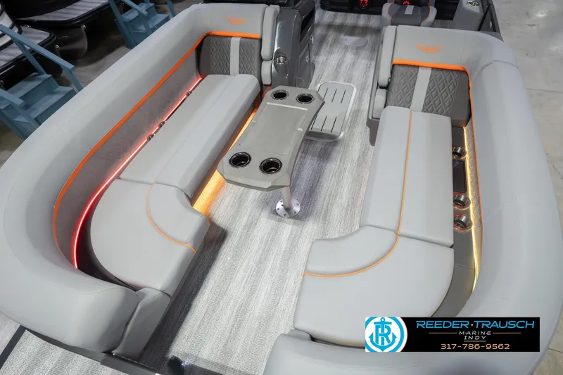 Slide: The Image of 2026 Bennington 24 MSB pontoon boat interior with gray seating and ambient lighting. - 12