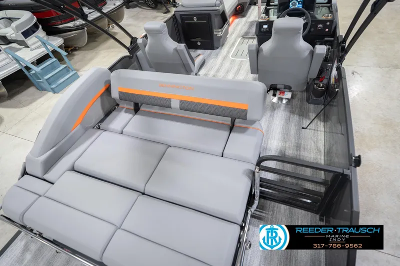 Slide: The Image of 2026 Bennington 24 MSB pontoon boat interior with gray seating and modern dashboard. - 14