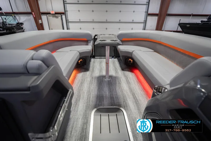Slide: The Image of Luxurious interior of 2026 Bennington 24 MSB pontoon boat with ambient lighting and plush seating. - 21