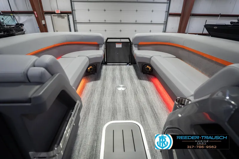 Slide: The Image of Interior of 2026 Bennington 24 MSB pontoon boat with modern seating and ambient lighting. - 22