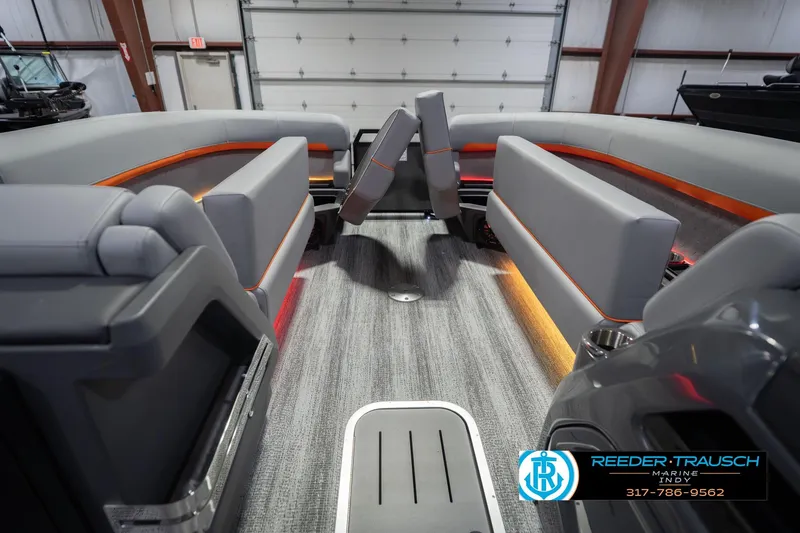 Slide: The Image of 2026 Bennington 24 MSB boat interior with modern seating and ambient lighting. - 23