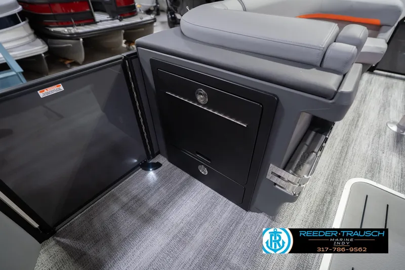 Slide: The Image of Interior of 2026 Bennington 24 MSB boat with seating and storage compartment. - 26