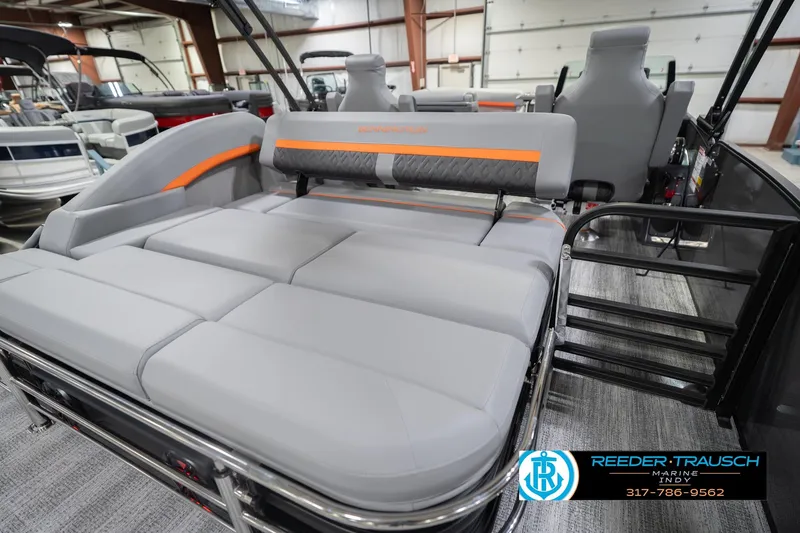 Slide: The Image of 2026 Bennington 24 MSB pontoon boat with luxurious seating in showroom. - 33