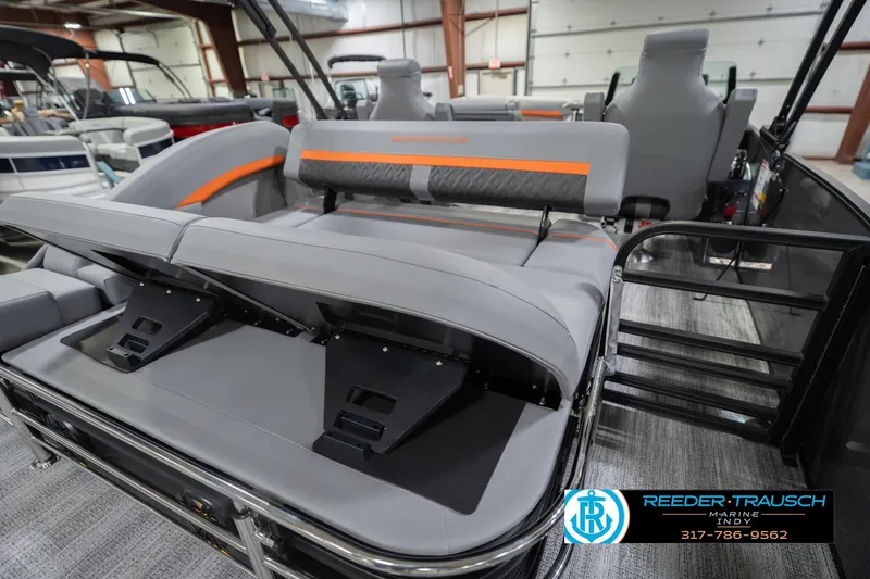 Slide: The Image of 2026 Bennington 24 MSB pontoon boat interior with gray seating and orange accents. - 35