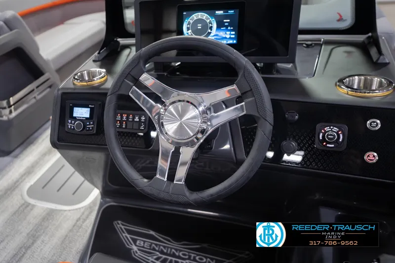 Slide: The Image of Steering wheel and dashboard of 2026 Bennington 24 MSB boat with modern controls. - 36