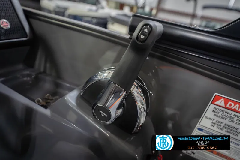 Slide: The Image of Throttle control of 2026 Bennington 24 MSB boat, featuring sleek design and warning label. - 43