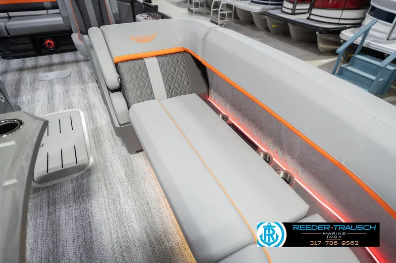 Slide: The Image of 2026 Bennington 24 MSB boat interior with modern seating and ambient lighting. - 48
