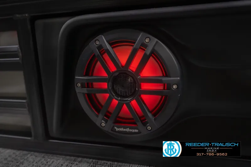 Slide: The Image of Red illuminated speaker on 2026 Bennington 24 MSB boat, featuring Rockford Fosgate audio system. - 49