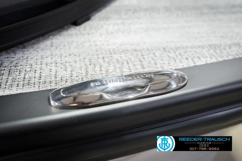 Slide: The Image of Close-up of 2026 Bennington 24 MSB boat detail with logo and textured surface. - 64
