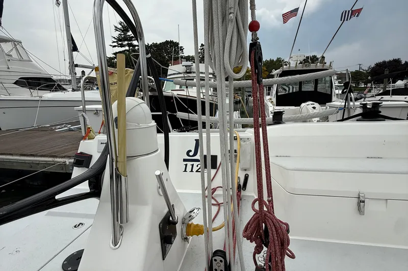 Slide: The Image of 2022 J Boats J/112E sailboat docked, showcasing rigging and deck details. - 13