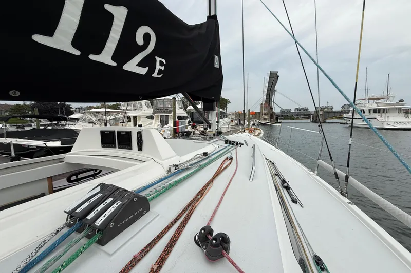 Slide: The Image of 2022 J Boats J/112E sailboat docked, showcasing deck and rigging details. - 17