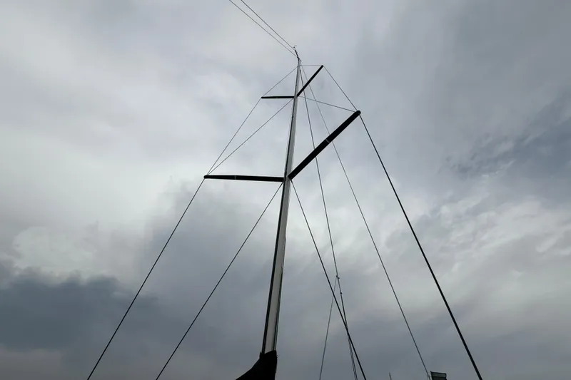Slide: The Image of Mast of 2022 J Boats J/112E sailboat against cloudy sky. - 18