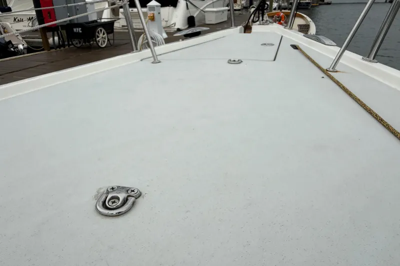 Slide: The Image of Deck view of 2022 J Boats J/112E sailboat at marina. - 24