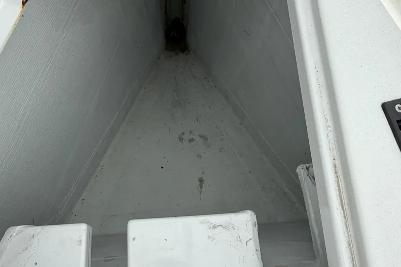 Slide: The Image of Interior view of 2022 J Boats J/112E sailboat compartment, showing clean, white surfaces. - 25