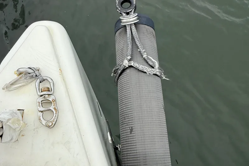 Slide: The Image of Bow of 2022 J Boats J/112E with dock fender and cleat. - 26