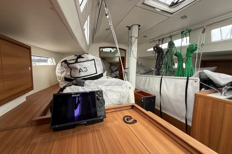 Slide: The Image of Interior of 2022 J Boats J/112E sailboat with navigation equipment and stored sails. - 28