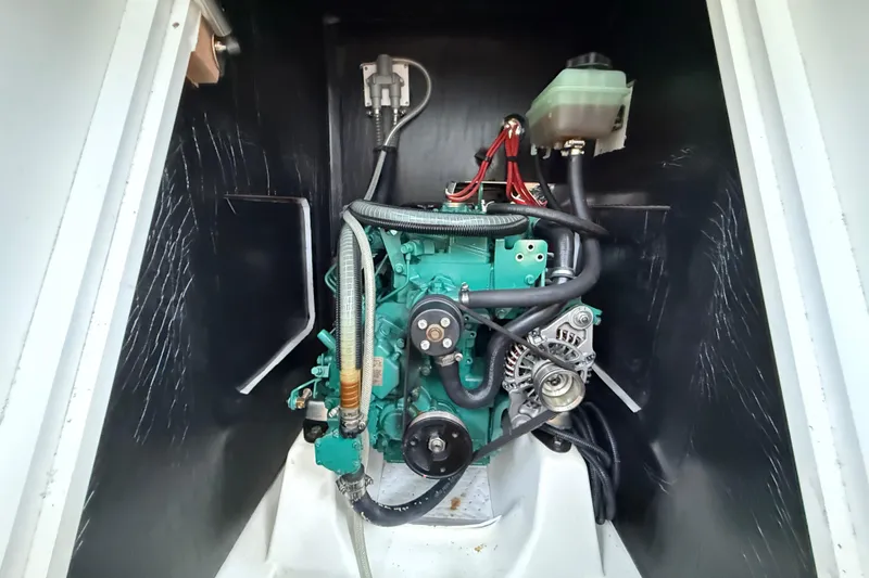 Slide: The Image of Engine compartment of a 2022 J Boats J/112E sailboat, showcasing mechanical components. - 38