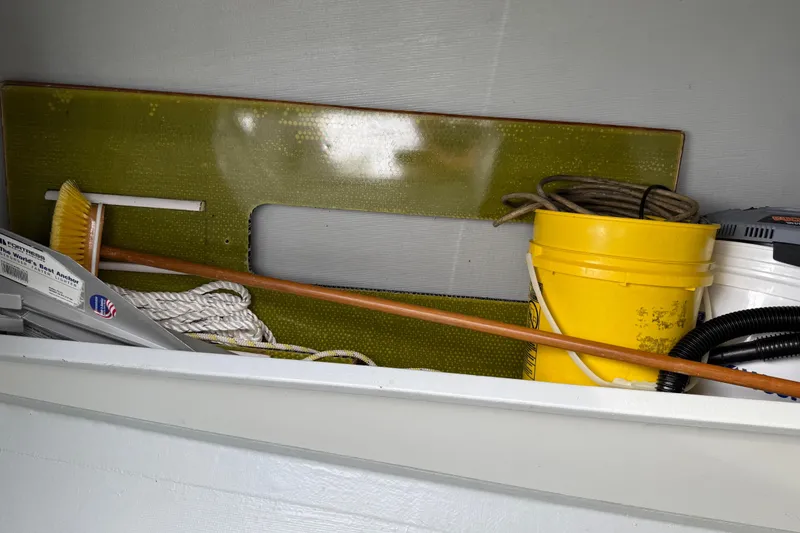 Slide: The Image of Storage area on a 2022 J Boats J/112E with cleaning supplies and equipment. - 40