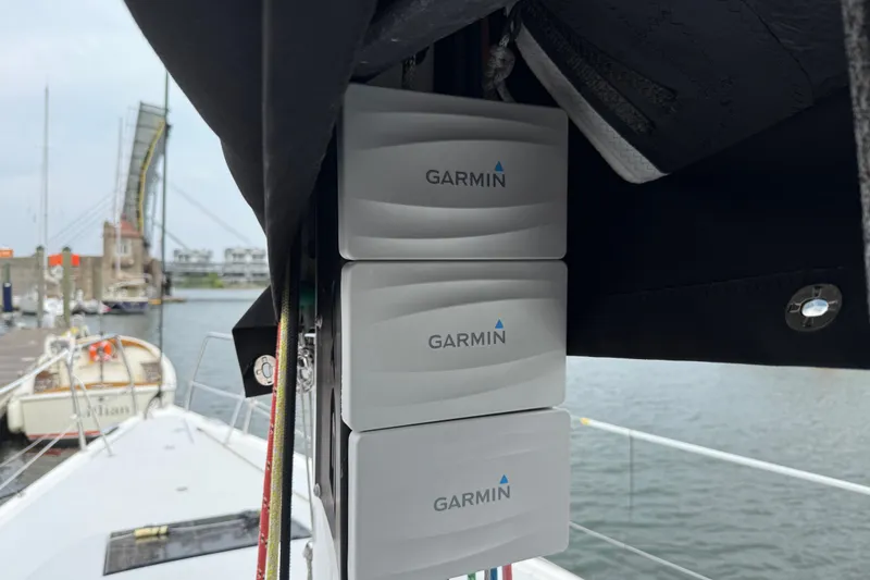 Slide: The Image of Garmin devices on a 2022 J Boats J/112E sailboat, docked near a bridge. - 42