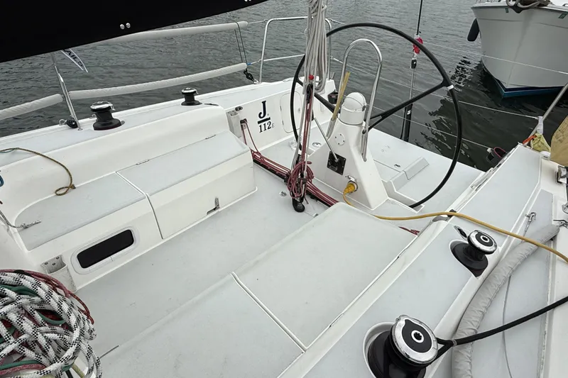Slide: The Image of 2022 J Boats J/112E sailboat cockpit with steering wheel and winches. - 7