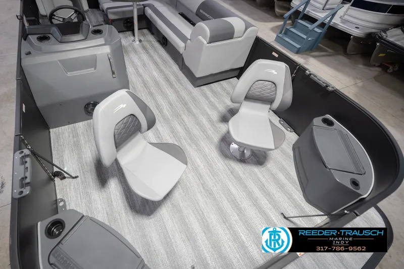 Slide: The Image of 2026 Bennington 21 SF boat interior with gray seating and flooring, featuring modern design elements. - 13