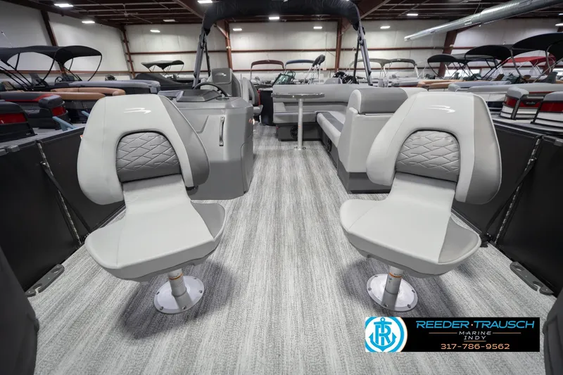 Slide: The Image of 2026 Bennington 21 SF boat interior with gray seating and modern design. - 16
