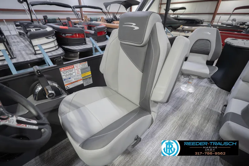 Slide: The Image of Captain's seat in a 2026 Bennington 21 SF boat, showroom display. - 24