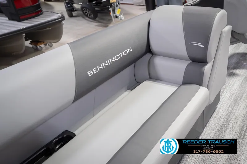 Slide: The Image of 2026 Bennington 21 SF boat interior with gray seating, showcased at Reeder-Trausch Marine. - 46