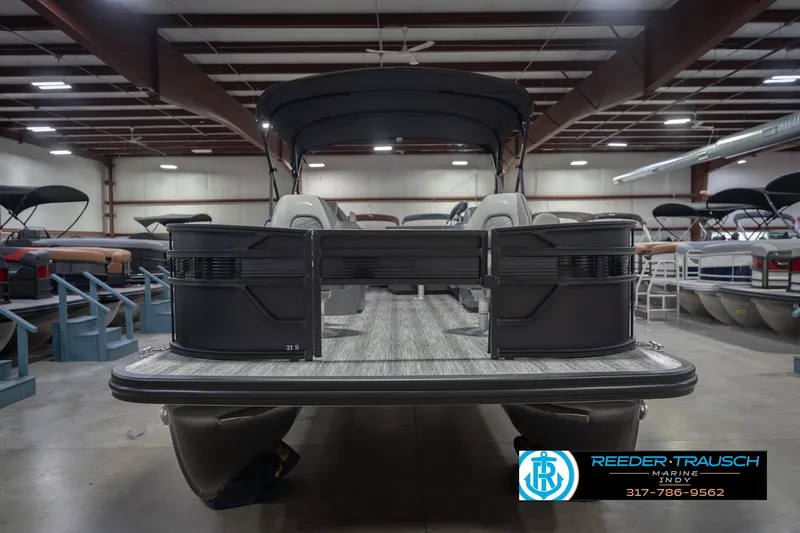 Slide: The Image of 2026 Bennington 21 SF pontoon boat in showroom, featuring sleek design and modern amenities. - 5