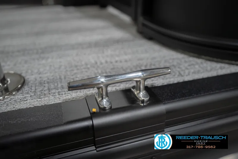 Slide: The Image of 2026 Bennington 21 SF boat cleat on textured deck, Reeder-Trausch Marine logo visible. - 55