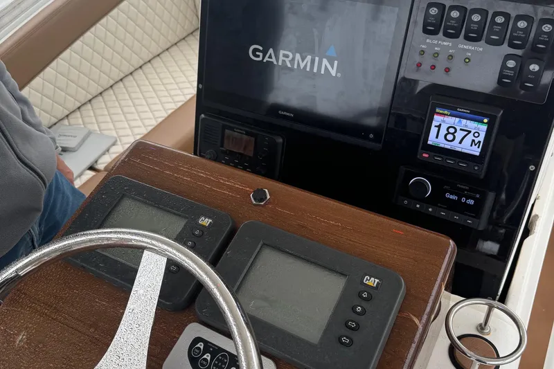 Slide: The Image of 2005 Egg Harbor 35' Express yacht kitchen with microwave and wooden cabinetry. - 10