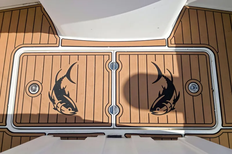 Slide: The Image of Teak deck of 2005 Egg Harbor 35' Express with fish design. - 15