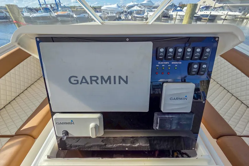 Slide: The Image of Control panel of a 2005 Egg Harbor 35' Express boat with Garmin navigation system. - 27