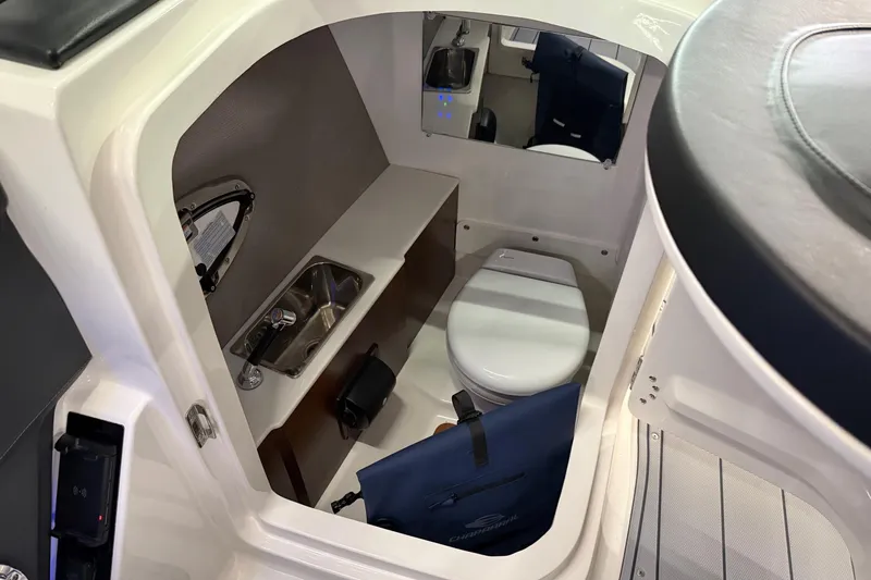 Slide: The Image of 2026 Chaparral 30 SSX boat interior with compact bathroom and sink. - 12