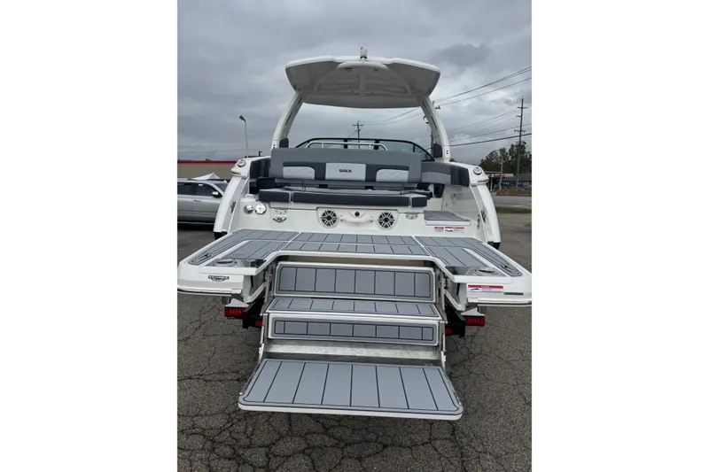 Slide: The Image of 2026 Chaparral 30 SSX boat rear view with extended swim platform and seating. - 3
